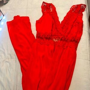 Im selling a bright red jumpsuit. Size M